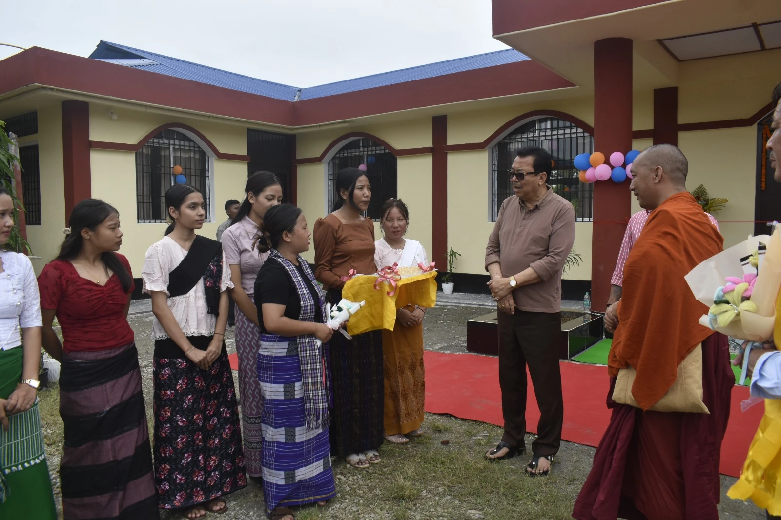 Visitors and students in the college courtyard