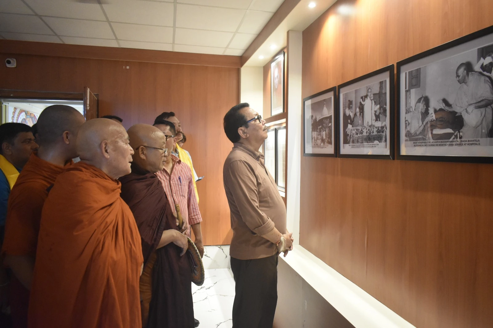 Visitors viewing a display at the college